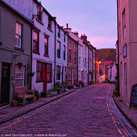 Buy canvas prints of Winter Sunset in Historic Staithes by Janet Carmichael
