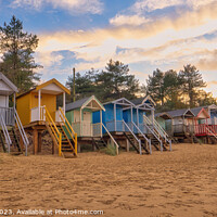 Buy canvas prints of Rainbow Coloured Beach Huts at Wells Next the Sea by Janet Carmichael