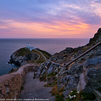 Buy canvas prints of Gentle Sunset Colours over South Stack Lighthouse by Janet Carmichael