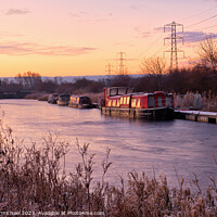 Buy canvas prints of Winter Sunrise over a Frozen River Carron by Janet Carmichael