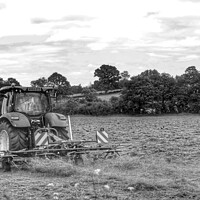 Buy canvas prints of Black and white Tractor in a field  by Ollie Hully