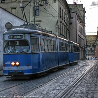 Buy canvas prints of Krakow Tram  by Jim McGarvie