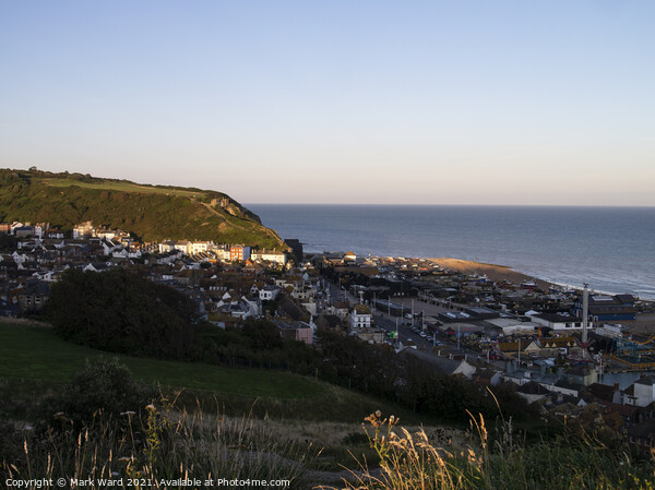 Hastings Seafront and Old Town as the Sun goes down. Picture Board by Mark Ward