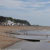 Buy canvas prints of Hastings Seafront from the Pier in August. by Mark Ward