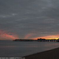 Buy canvas prints of Autumn Dusk at Hastings Pier. by Mark Ward