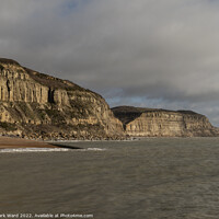 Buy canvas prints of The Cliffs of Hastings on a Moody Day. by Mark Ward