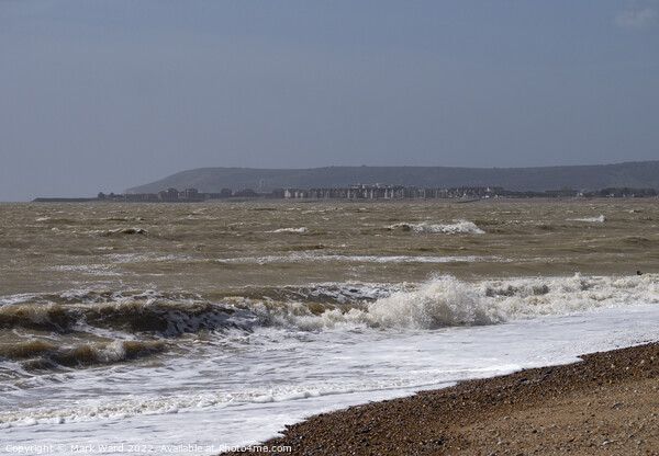 Eastbourne across the water from Pevensey Bay. Picture Board by Mark Ward