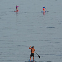 Buy canvas prints of Paddleboard Trio by Mark Ward
