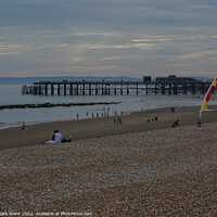 Buy canvas prints of Early Summer evening on Hastings beach by Mark Ward