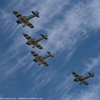 Buy canvas prints of Light Aircraft in Formation. by Mark Ward