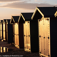 Buy canvas prints of Sunkissed Freezing Beach huts. by Mark Ward