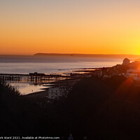 Buy canvas prints of Hastings Pier at Sunset. by Mark Ward