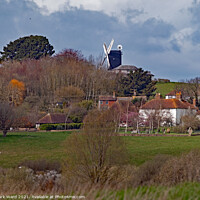 Buy canvas prints of The Mill Studios in Icklesham, seen from Pett Level. by Mark Ward