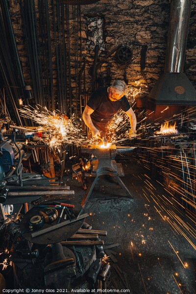 Sparks fly as metal is forged  Picture Board by Jonny Gios