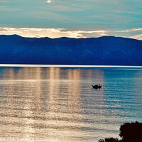 Buy canvas prints of  Lone fishing boat on the Ionian Sea  by Gaynor Ball