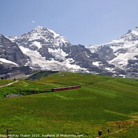 Buy canvas prints of Famous electric red tourist train with mountains in the background by PhotOvation-Akshay Thaker