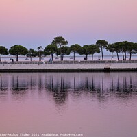 Buy canvas prints of Beautiful twilight pink and blue sunset sky and a boardwalk on Tagus River. by PhotOvation-Akshay Thaker