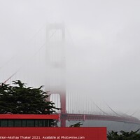 Buy canvas prints of The Golden Gate Bridge partially covered under the Fogg. by PhotOvation-Akshay Thaker