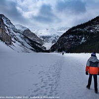 Buy canvas prints of Tourists kids are walking on top of the frozen lake Louise Canadian and Tourists are enjoying winter by PhotOvation-Akshay Thaker
