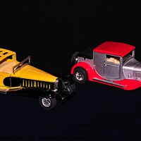 Buy canvas prints of Two vintage red and yellow cars models  by PhotOvation-Akshay Thaker