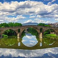 Buy canvas prints of Photography with the Roman bridge and its reflection in the river on the Camino de Santiago by Vicen Photo