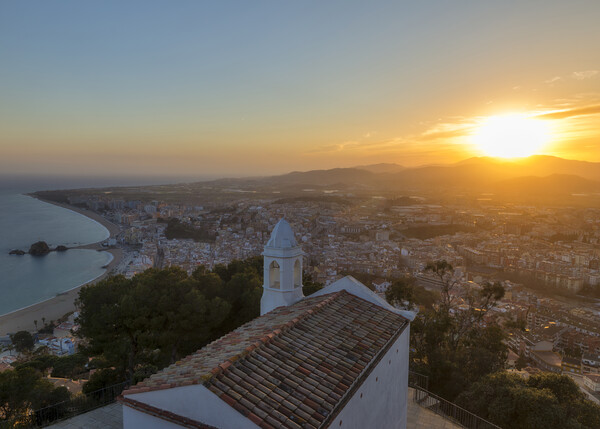 Photography with a hermitage and the town of Blanes from the viewpoint during sunset Picture Board by Vicen Photo
