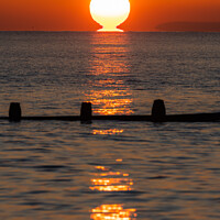 Buy canvas prints of Sun touching the sea by Geoff Smith