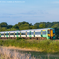 Buy canvas prints of Southern Train in South Downs by Geoff Smith