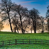 Buy canvas prints of Winter Sunrise through Trees by Geoff Smith