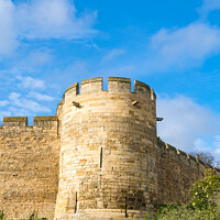 Buy canvas prints of Lincoln Castle Corner Tower and Walls by Allan Bell