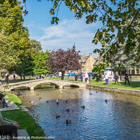 Buy canvas prints of Footbridge on River Windrush Bourton-on-the-Water by Allan Bell