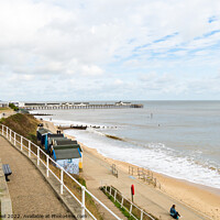 Buy canvas prints of Southwold seafront view of beach huts and pier  by Allan Bell