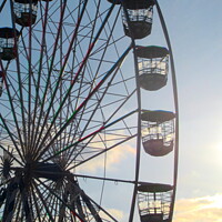Buy canvas prints of Ferris Wheel At Sunset by andrew morrell