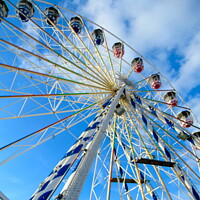 Buy canvas prints of Ferris Wheel In Blue Sky  by andrew morrell