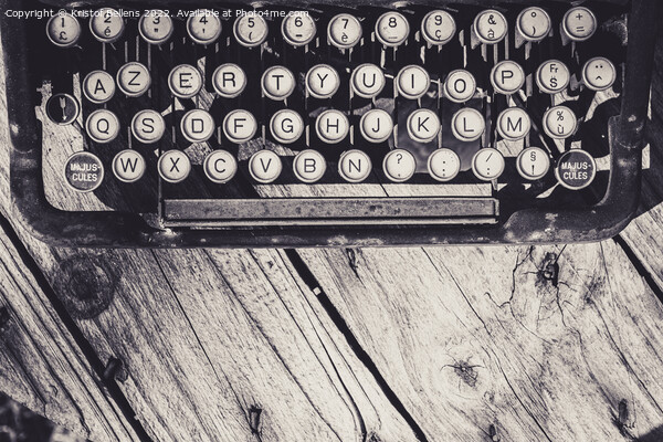 Old and weathered antique typewriter keyboard on wooden background in greyscale. Picture Board by Kristof Bellens