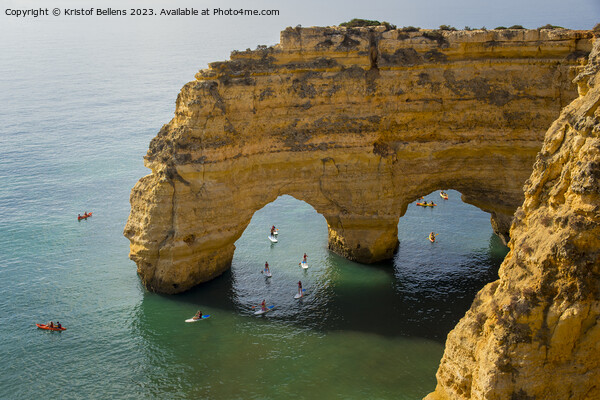 Kayaks and sup boards peddling under the Arco Natural on the Algarve coast in Portugal. Picture Board by Kristof Bellens