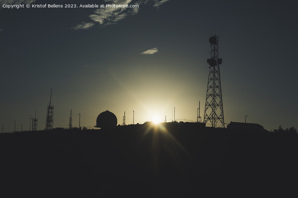 Silhouette of communication towers against a sunset. Picture Board by Kristof Bellens