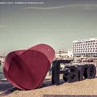Buy canvas prints of View on the I love Faro sign and Eva Senses Hotel in the marina of Faro, Portugal. by Kristof Bellens