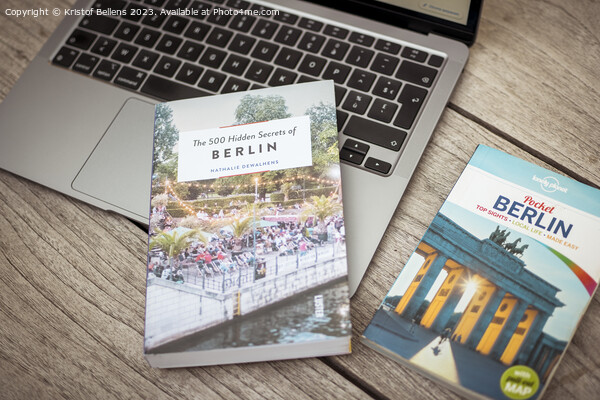 Planning a trip to Berlin with laptop on wooden table and travel guides Picture Board by Kristof Bellens