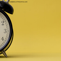 Buy canvas prints of Analog alarm clock displaying five o'clock on a yellow background with copy space by Kristof Bellens
