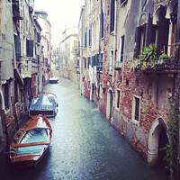 Buy canvas prints of Boats in a small canal in Venice during a rainy day in Autumn by Kristof Bellens