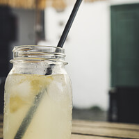 Buy canvas prints of Vertical shot of a jar with homemade lemon lemonade by Kristof Bellens