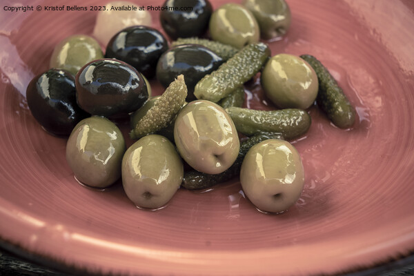 Close-up shot of mix of black and green olives with pickle in an orange bowl. Picture Board by Kristof Bellens