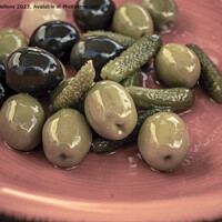 Buy canvas prints of Close-up shot of mix of black and green olives with pickle in an orange bowl. by Kristof Bellens