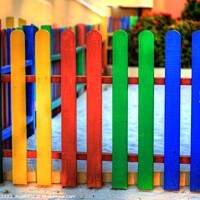 Buy canvas prints of Colourful Caribbean fence by Eti Reid