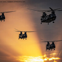 Buy canvas prints of Chinook evening flight by Cliff Kinch