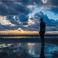 Buy canvas prints of Anthony Gormley Statue standing on a beach in fron by Vicky Outen