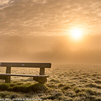 Buy canvas prints of A bench at sunrise on a foggy winter morning by Gary Holpin