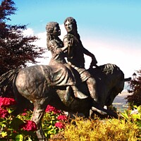 Buy canvas prints of A statue of a couple  riding a horse by Stephanie Moore