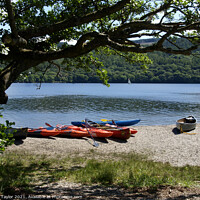 Buy canvas prints of Canoes on the edge of Coniston Water  by Nik Taylor